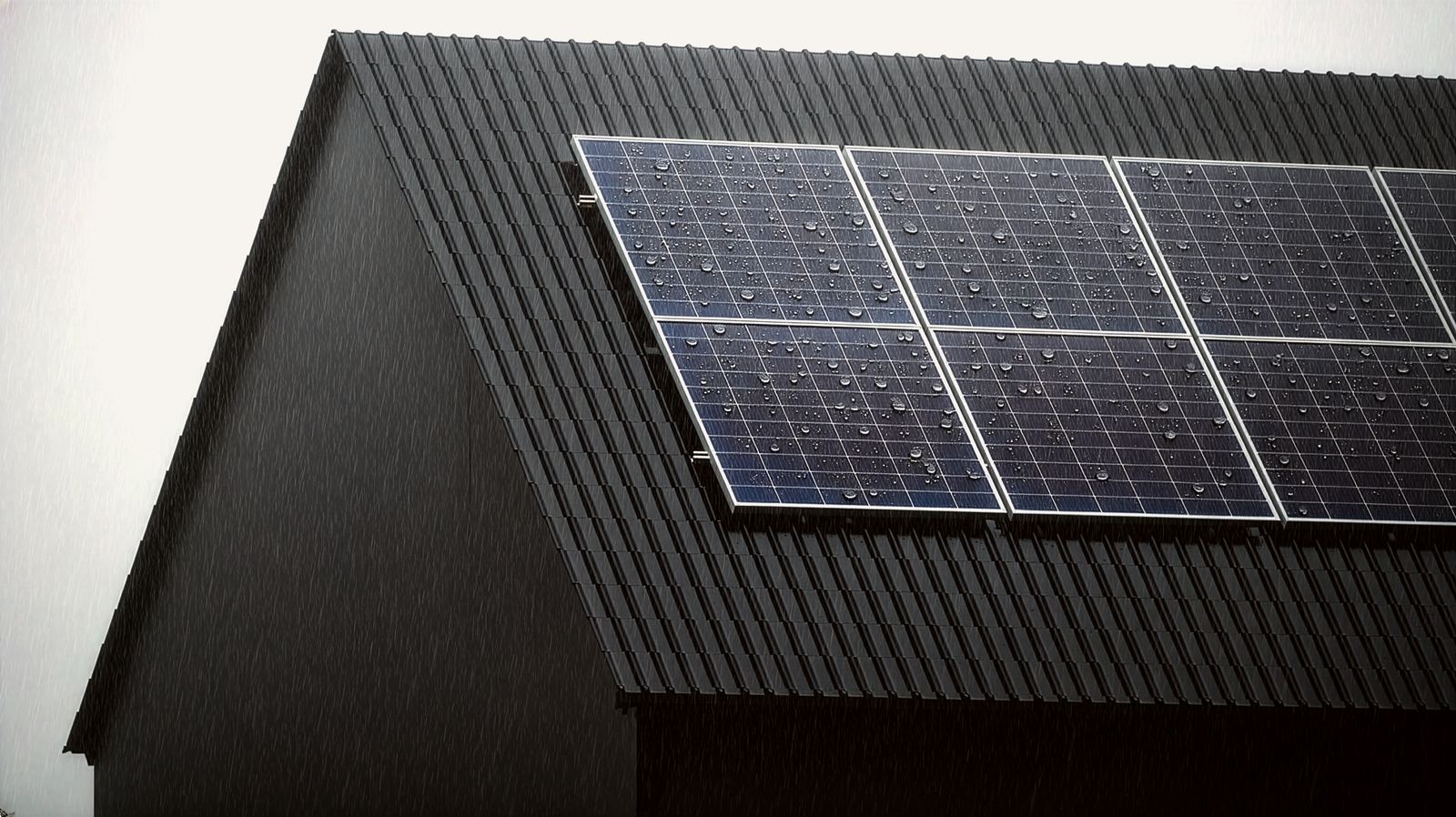Solar panels on a dark tiled roof in the rain.